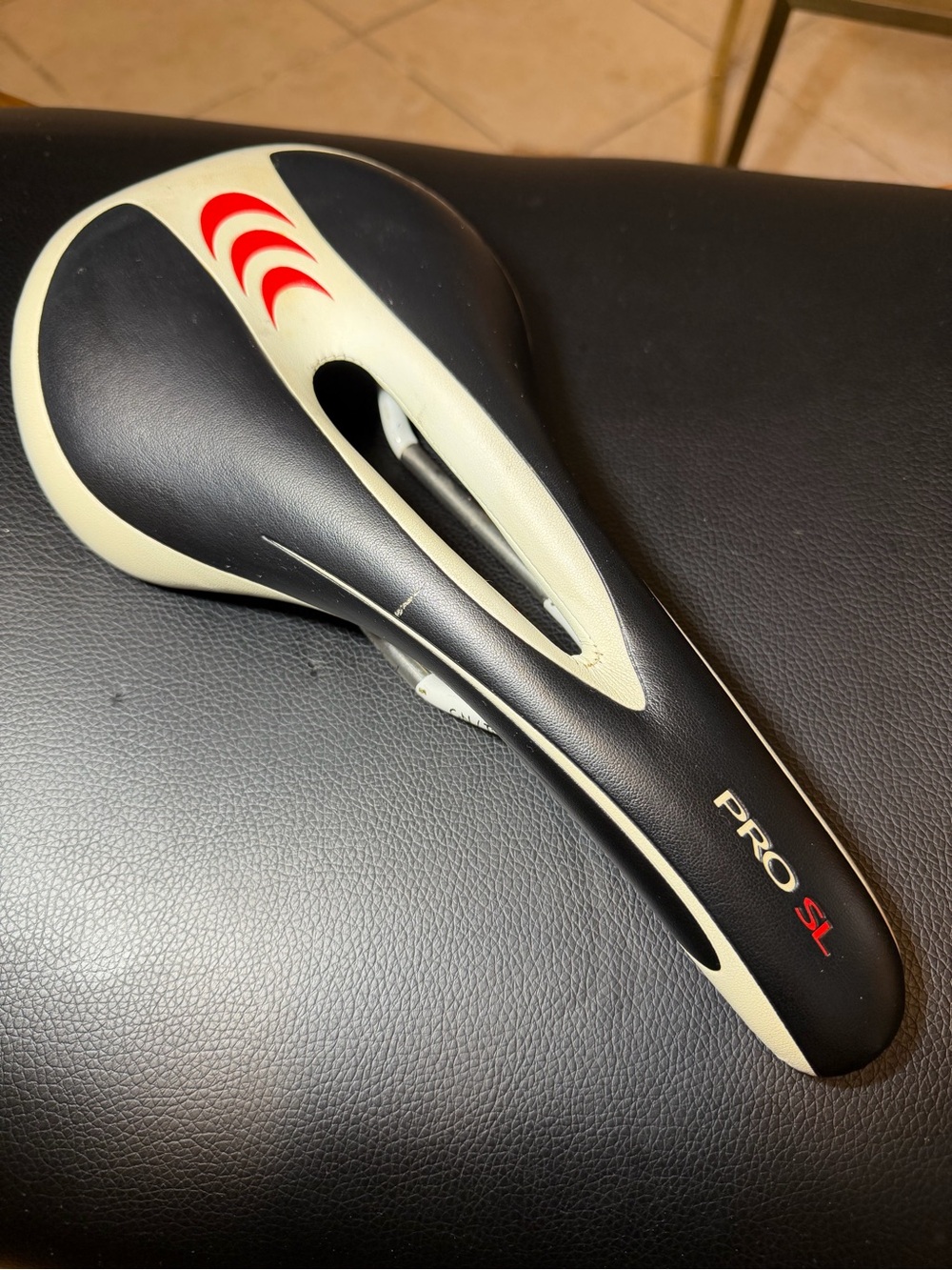 Forte Pro SL Cutout Bicycle Saddle in Black & Cream with Red Accents